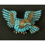 A 19TH CENTURY TURQUOISE SET EAGLE BROOCH in silver with gold facings, back and fittings, engraved