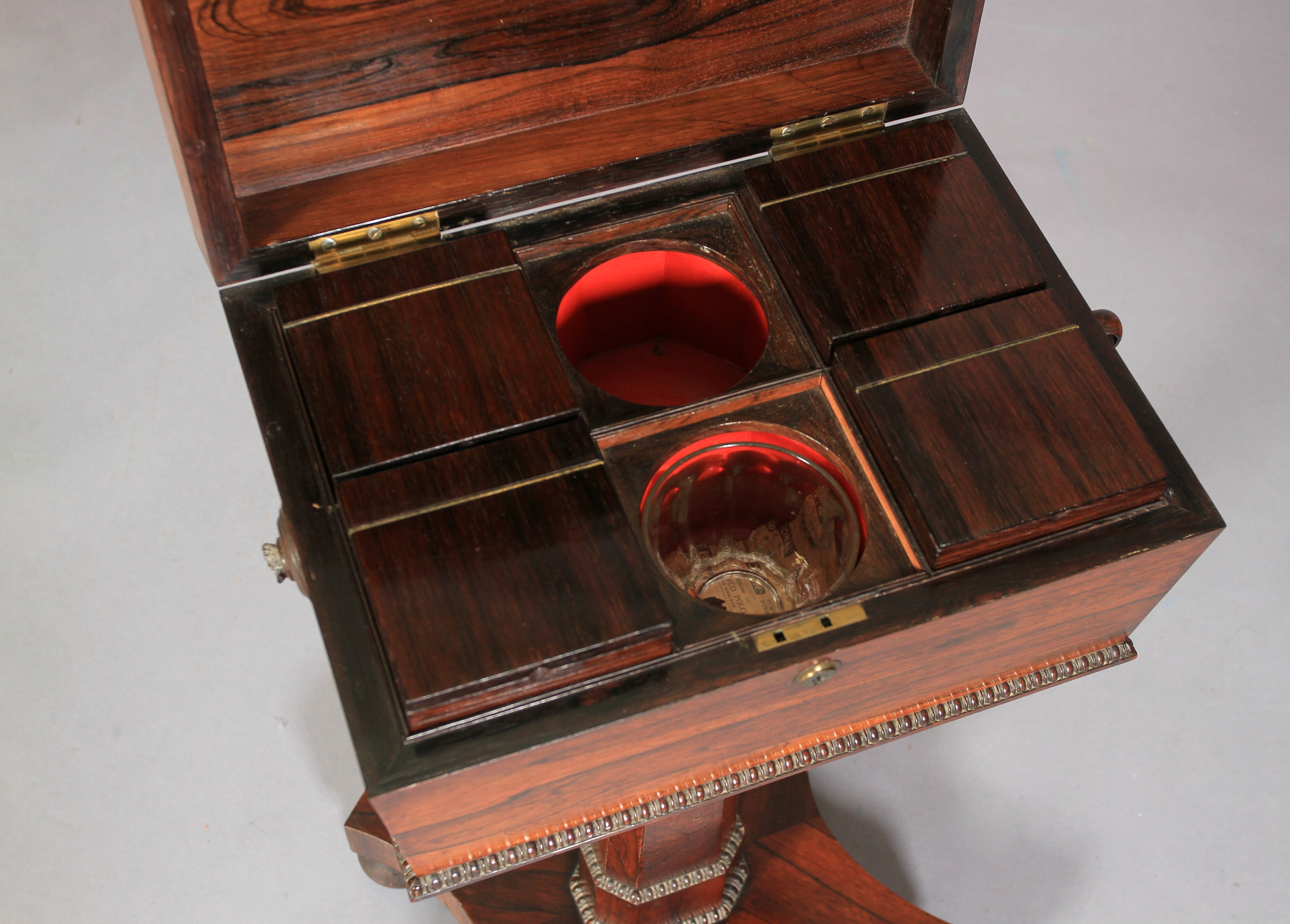 A REGENCY ROSEWOOD VENEERED TEAPOY of conventional form, the sarcophagus shaped top with reel - Image 3 of 3