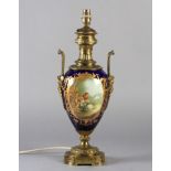 A LATE 19TH CENTURY ORMOLU MOUNTED PORCELAIN VASE, the urn shaped body painted to the front with a