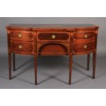A GEORGE III MAHOGANY BREAKFRONT SIDEBOARD, outlined throughout with broad satinwood crossbanding,
