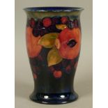 A WILLIAM MOORCROFT POMEGRANATE DESIGN VASE c.1925, ovoid with everted rim, on circular spreading