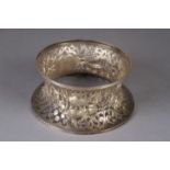 AN IRISH SILVER POTATO RING, Dublin 1906, maker E Johnson Ltd, pierced in a design scrolling leafage