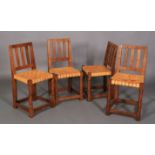 A THOMPSON OF KILBURN 'MOUSEMAN' SET OF FOUR OAK SINGLE CHAIRS, each having three broad vertical