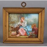 A SMALL CONTINENTAL PORCELAIN RECTANGULAR PLAQUE, painted with a seated female reading a letter, a