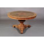 AN EARLY VICTORIAN ROSEWOOD VENEERED CIRCULAR BREAKFAST TABLE, the segmented top with foliate arched