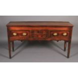 AN EARLY 19TH CENTURY FRUITWOOD DRESSER BASE, having a bead rail to the surface above two short