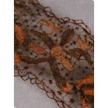 A 17TH CENTURY BAND OF HAIR NEEDLE LACE, worked with birds and flowering scrolls, approximately 15cm