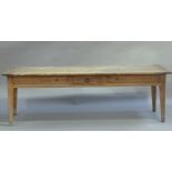 A FRENCH OAK FARMHOUSE TABLE, having a planked top with cleat ends, the apron having a small