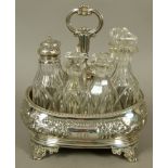 AN EARLY VICTORIAN ROUNDED RECTANGULAR CRUET FRAME with post and ring handle, the body embossed