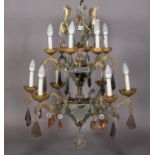 A SPANISH THREE TIER SIX FLATTENED ARM CHANDELIER with three mirrored hexagonal pendants, the