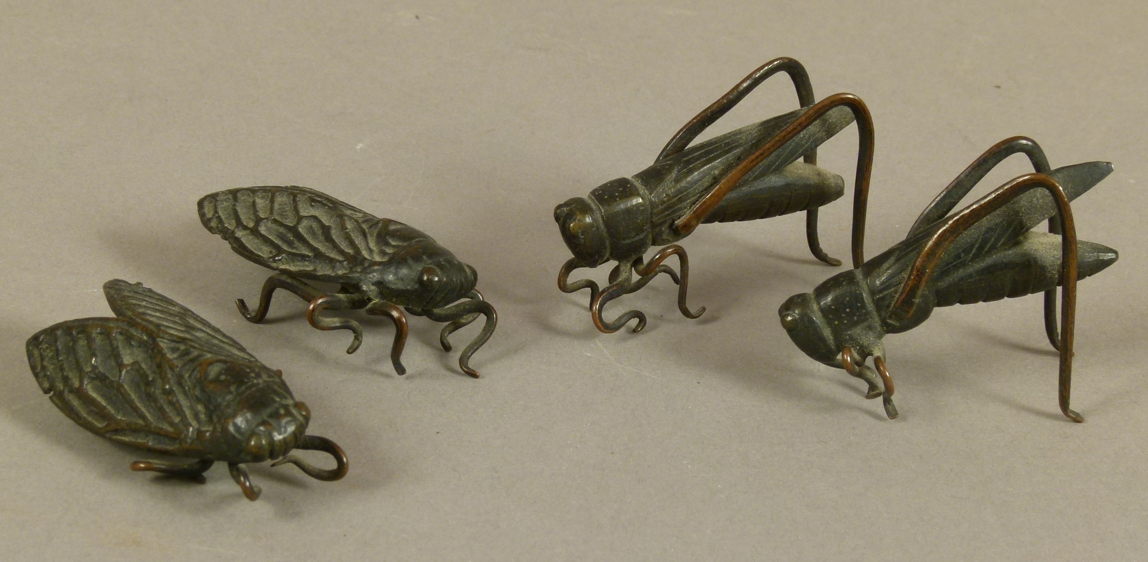 FOUR JAPANESE BRONZE INSECTS, Meiji period including two crickets and two cicadas, 5cm wide and