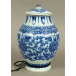 A CHINESE BLUE AND WHITE BALUSTER VASE AND COVER, the body painted with flowerheads and scrolling