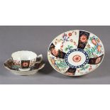 AN 18TH CENTURY WORCESTER CUP AND SAUCER, the panelled decoration in the Japanese taste, with