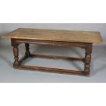 A LATE 17TH CENTURY OAK REFECTORY TABLE, having a planked surface with cleat ends, moulded apron