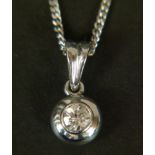 A DIAMOND PENDANT IN 18CT WHITE GOLD, the brilliant cut stone bubble set below pendant loop hung