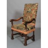 A WALNUT OPEN ARMCHAIR, 17th century and later, the rectangular high back and seat upholstered in