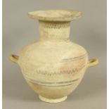 AN ANCIENT GREEK OR SOUTHERN MEDITERRANEAN THREE HANDLED AMPHORA with cylindrical neck and wide rim,