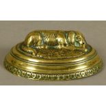 W.AVERY & SON, REDDITCH - AN OVAL BRASS NEEDLE CASE, the hinged lid with recumbent dog on a grass