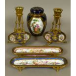 A PAIR OF LATE 19TH CENTURY FRENCH PORCELAIN AND GILT BRONZE MOUNTED PEN TRAYS, each oblong dish