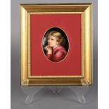 A VIENNA PORCELAIN OVAL PORTRAIT PLAQUE, head and shoulders of an infant with its hands clasped,