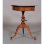 A REGENCY MAHOGANY READING TABLE line inlaid throughout with ebony stringing, the rounded oblong top