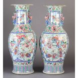 A LARGE PAIR OF CANTONESE PORCELAIN VASES c.1880 of baluster form, each painted with figures at