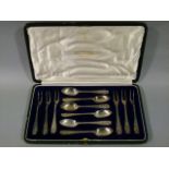 A cased set of six silver teaspoons and six two pronged forks in fitted case by Ogden and Sons of