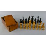 A Treen chess set in wooden box with sliding lid