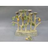 An art pottery ceramic candelabra modelled as five trees with partridge and pears, 38cm high (a/f)