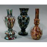 A Victorian black glass vase enamelled with a trellis of multi-coloured flowers and two marbled