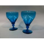 A pair of turquoise glass rummers