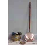 A Victorian copper warming pan, a brass coal scuttle and a brass hot water bottle