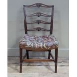 An 18th century style mahogany single chair having pierced and honeysuckle ladder back, reeded