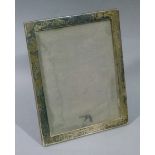 A silver photograph frame rectangular of plain design, Birmingham 1925, 22.5cm x 18cm