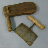 A bird scarer together with an English beat cutter with wooden handle