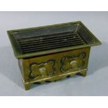 A Victorian brass fronted and tin burner, rectangular with lift out grill, the base with side