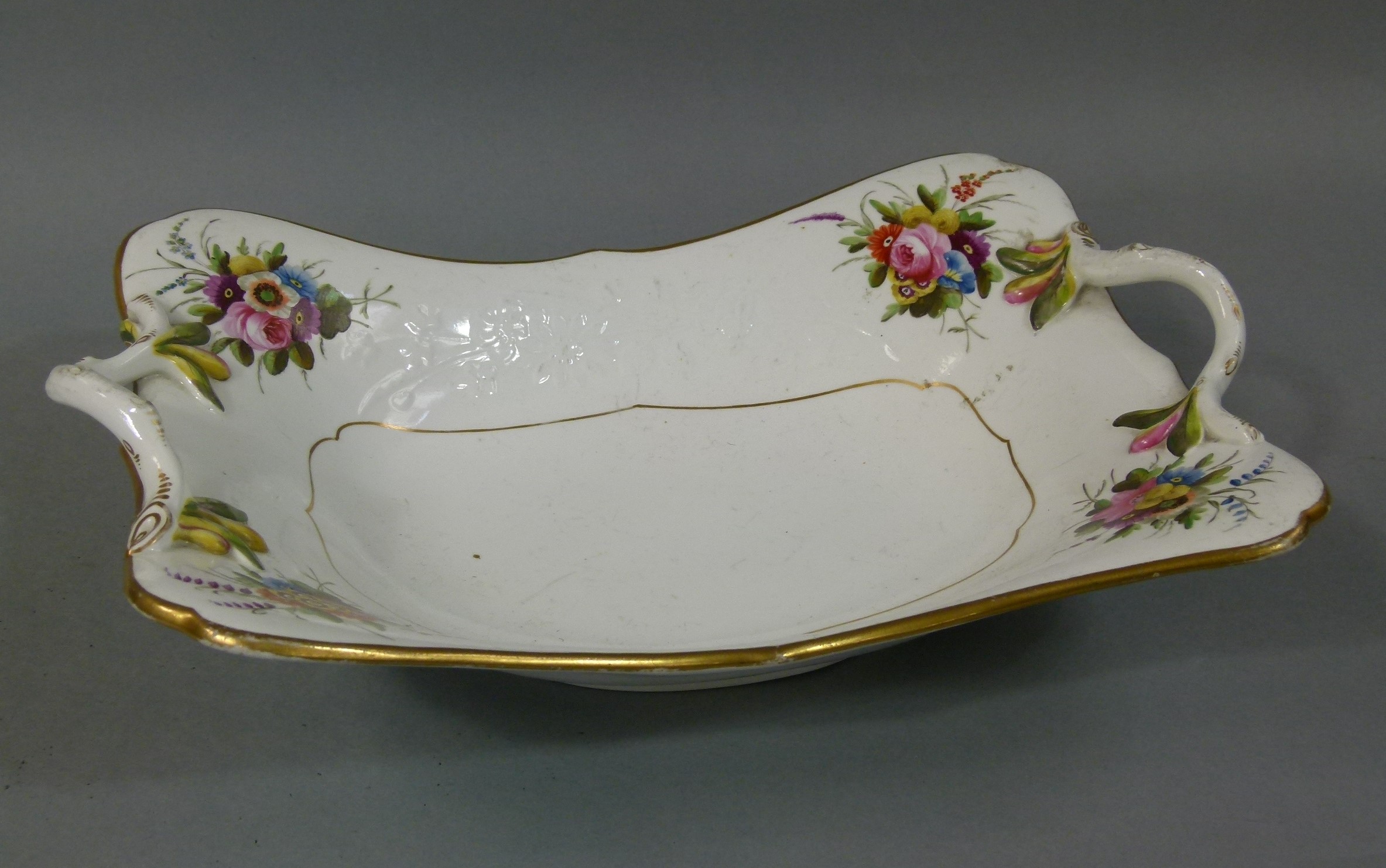 An early 19th century Spode compote, rectangular, with rustic handles and polychrome enamelled