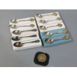 A quantity of spoons, boxed and loose EPNS and ten silver, together with a rifle medal
