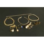 A collection of 9ct gold jewellery including bracelets, rings, brooches and earrings variously set
