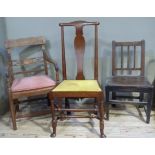 A walnut Queen Ann style single chair having a yoke top rail above a vase splat upholstered seat and