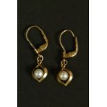 A pair of cultured pearl earrings in 9ct gold the 4.5mm pearls set within a marquise surround hung