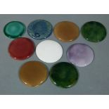 A collection of Moorcroft pottery inserts, circular, in various colour glazes, one stamped Moorcroft