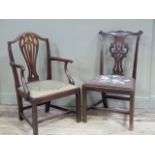 A Hepplewhite style mahogany elbow chair with camel back and waisted pierced splat, drop in seat