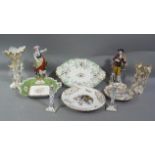 A quantity of decorative ceramics including pair of figurines, comports, spill vases, candlesticks