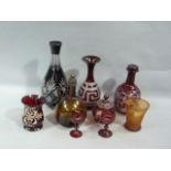 A quantity of Victorian and later coloured glassware including ruby glass carafe, wheel engraved