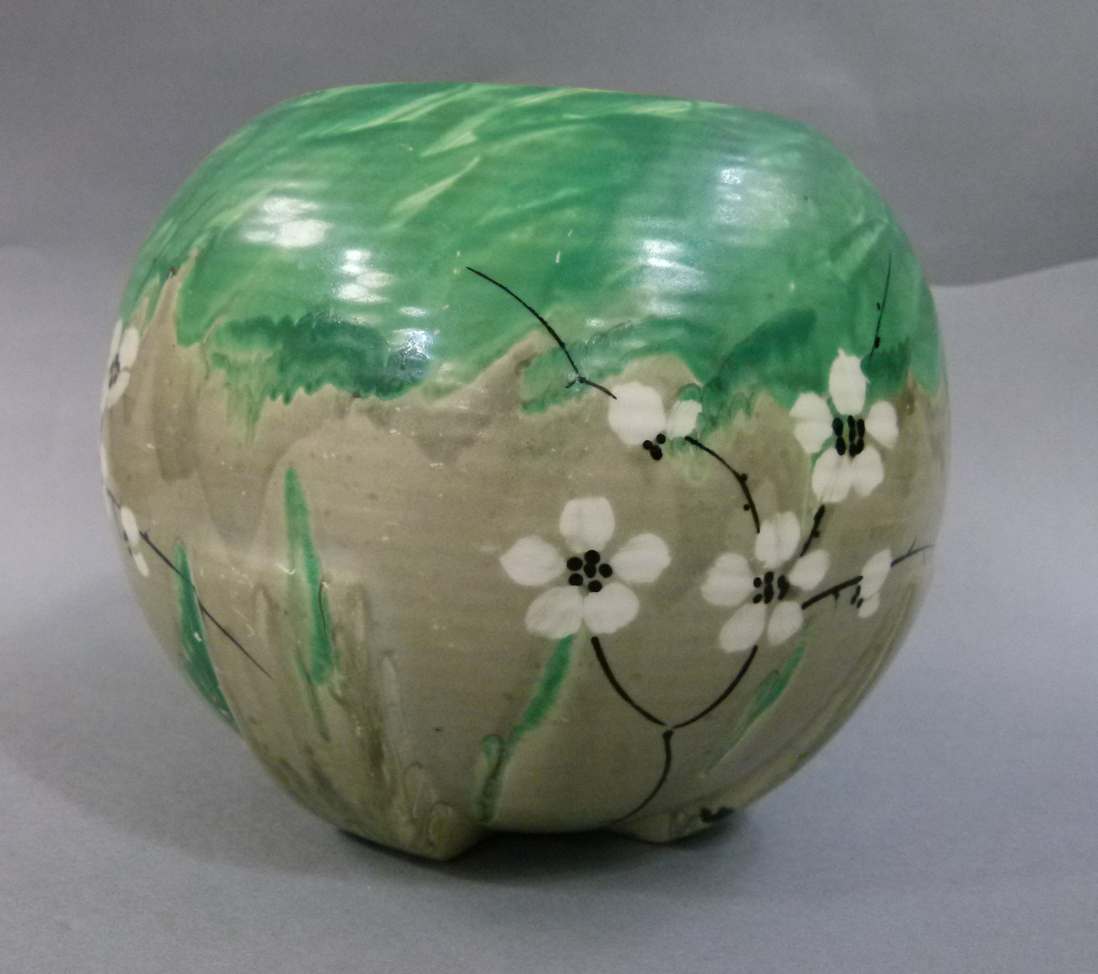 A Myott and Sons globular vase, moulded with rectangular fins from the base and enamelled in