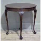 Pratts of Bradford - a George III style mahogany circular table, the top with gadrooned lip above