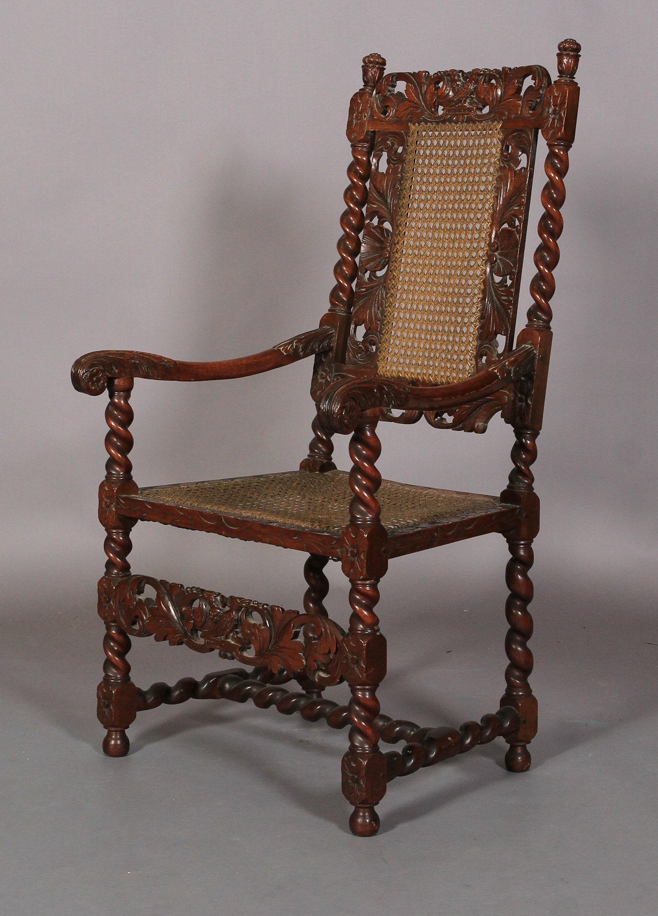 A Charles II style walnut armchair 19th century, having a pierced cresting carved with pair of birds
