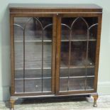 A reproduction mahogany veneered display cabinet, the pair of doors with applied lancet arched