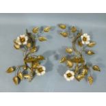 A pair of gold painted floral candle brackets S-scroll form with pair of cream and yellow flowers,